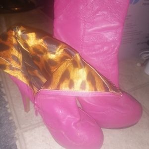Hot pink skull mid-calf boots with a 1 inch heel.